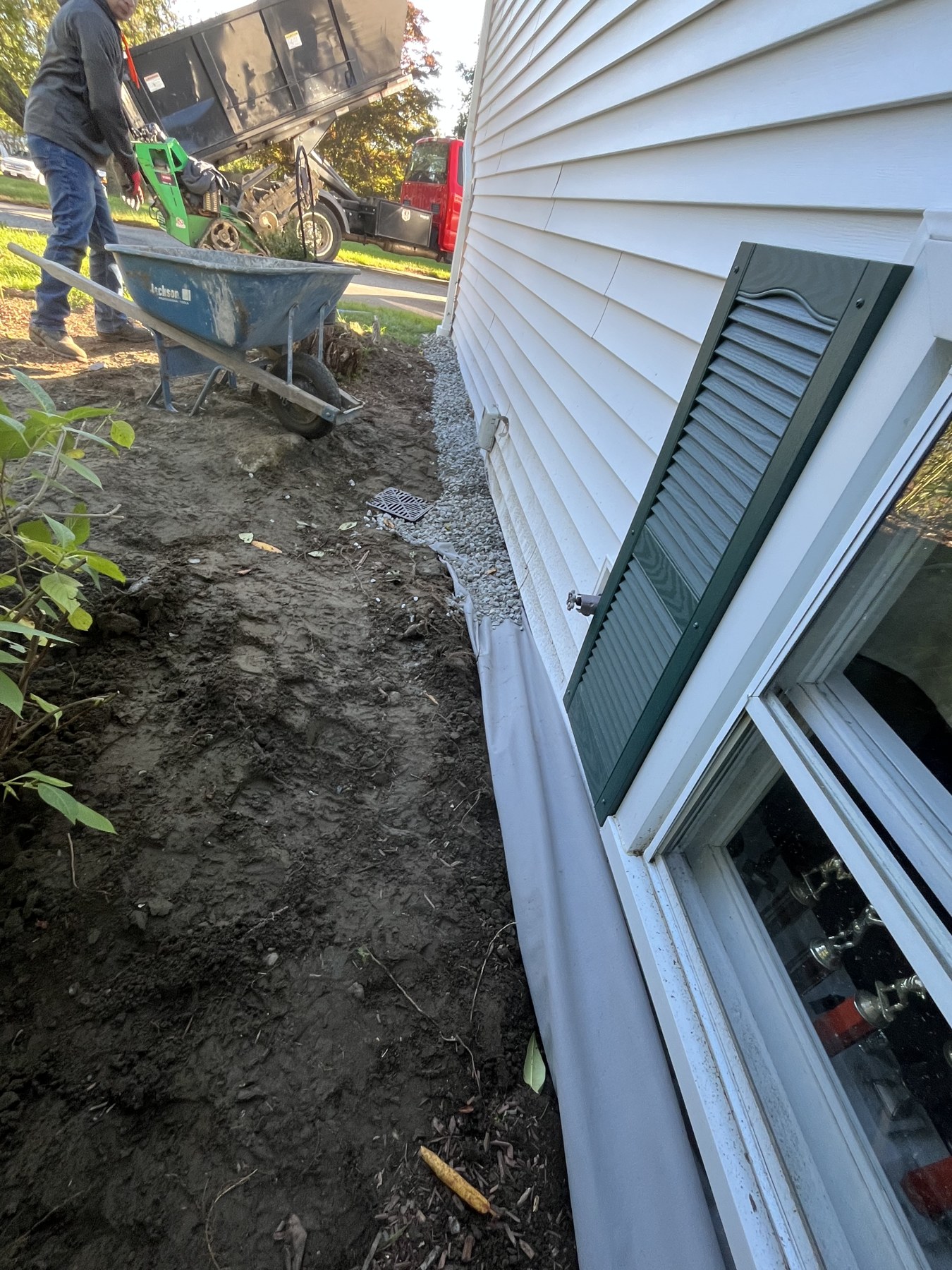 Drainage inlet and stone border by Blue Line